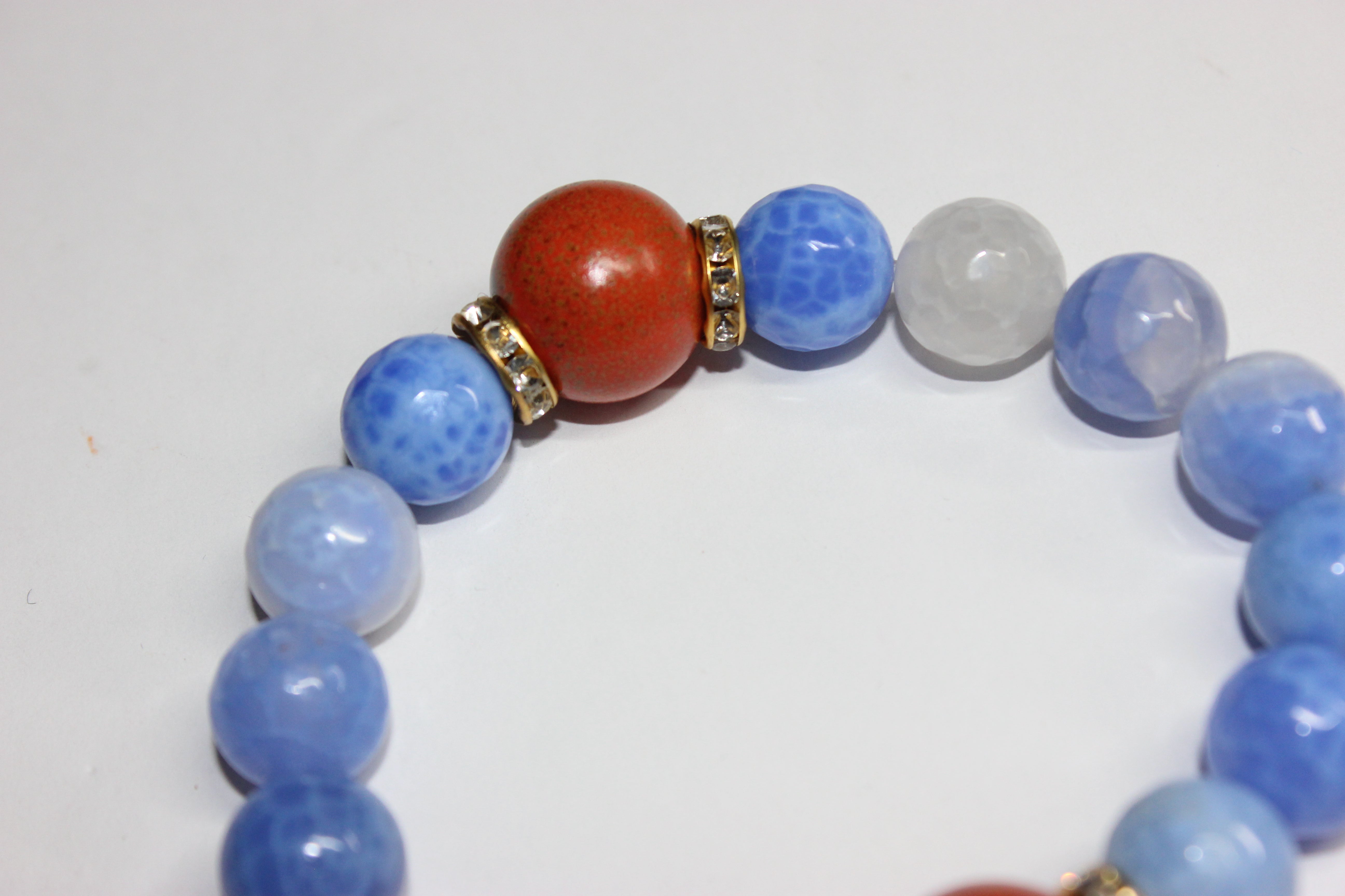 Shades Of Blue & Orange Beaded Bracelet Set In Gold