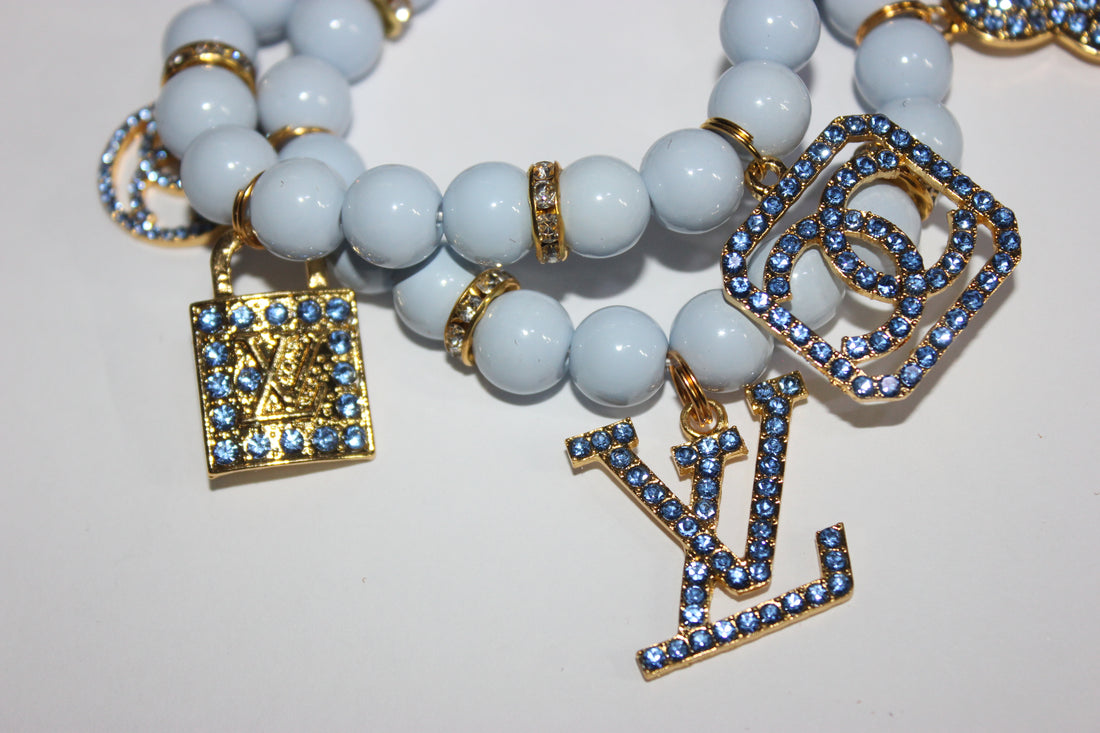 2 Piece Shades Of Light Blue & Gold Charm Bracelet Set